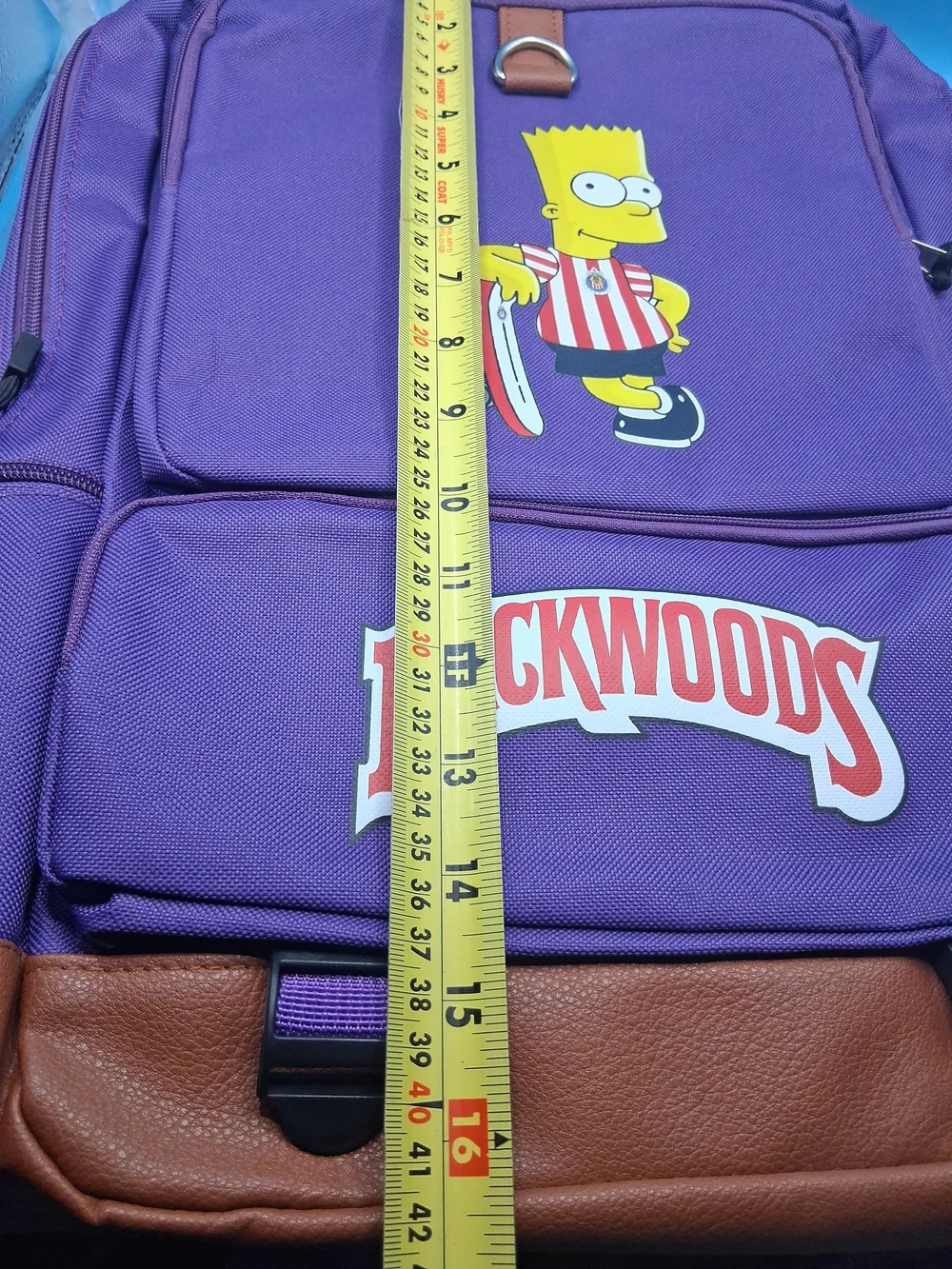 Purple Backpack with Brown Trim and Skate Graphic